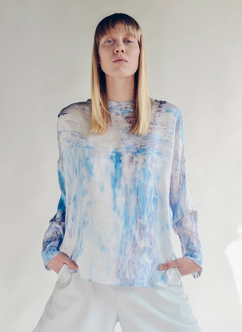 female model standing with her hands in pockets