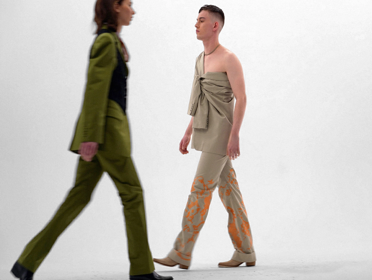 runway shot of 2 models walking
